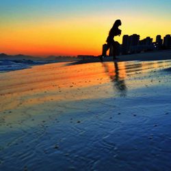 Silhouette of people at sunset