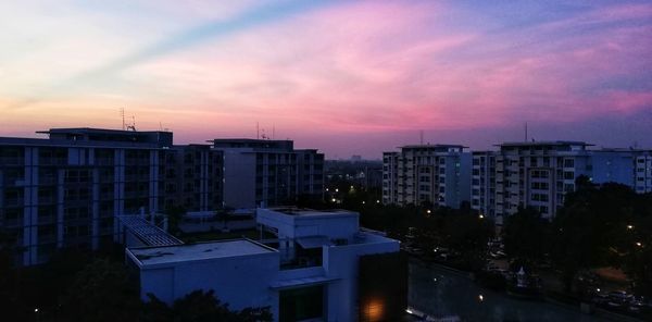 High angle view of buildings against sky at sunset