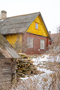 House against clear sky during winter