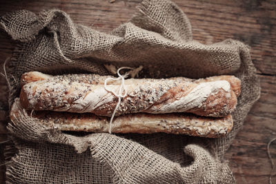 Directly above shot of breads in sack on floorboard