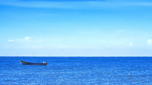 Boat in sea against sky