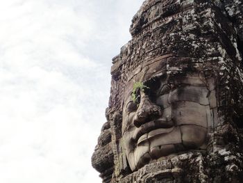 Low angle view of statue against sky