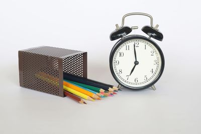 Close-up of colored pencils on white background