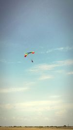 Low angle view of parachute against sky