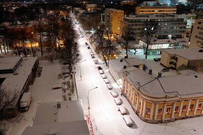 High angle view of street amidst buildings during winter