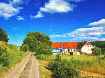 View of road against cloudy sky