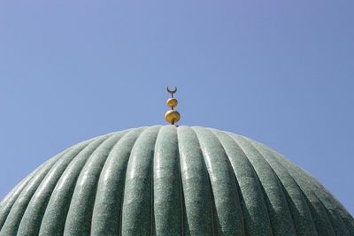 Low angle view of built structure against clear blue sky