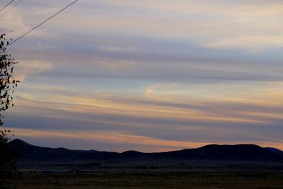 Scenic view of silhouette landscape against sky during sunset