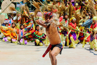 Full length of shirtless man dancing