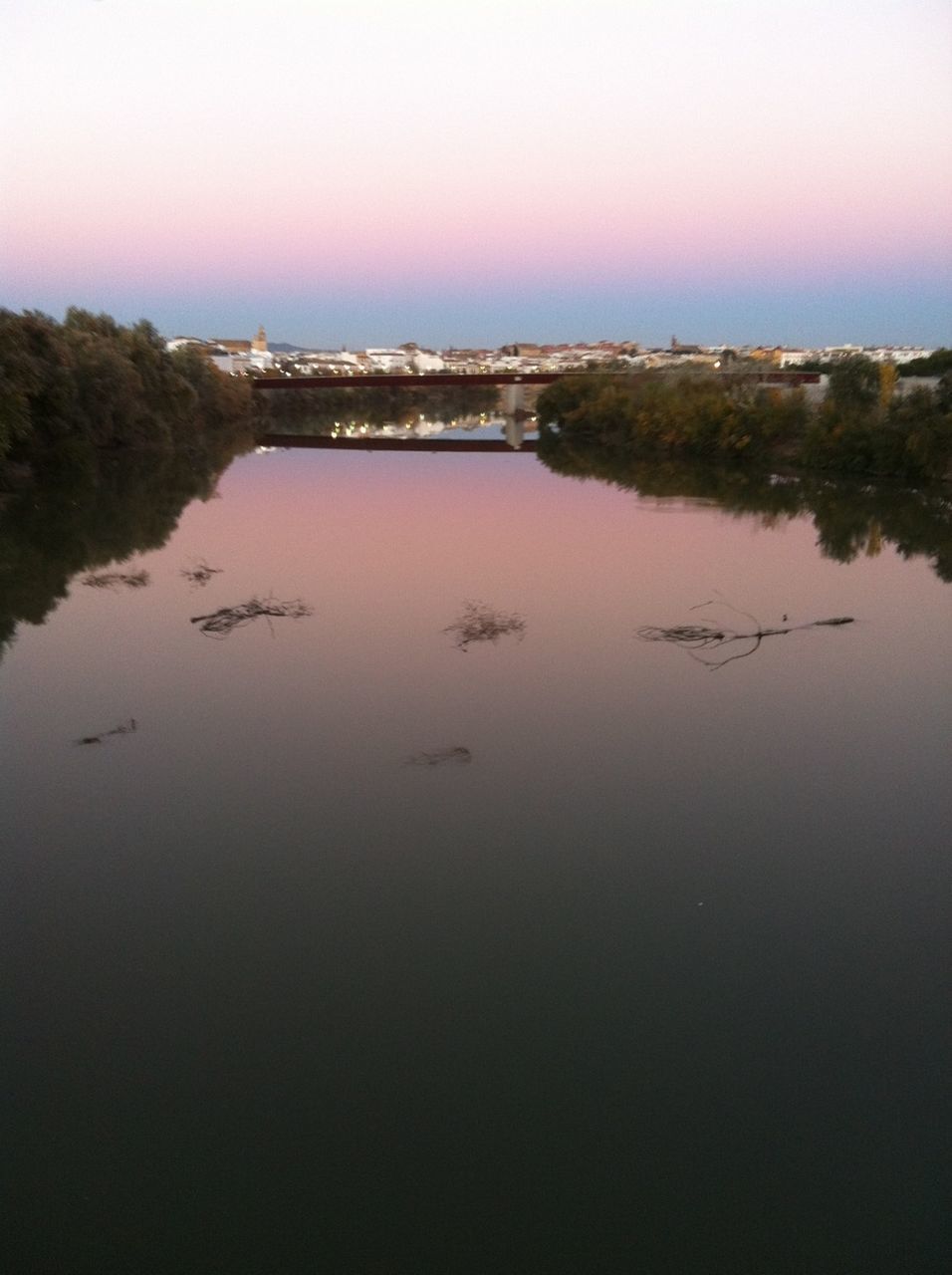 sunset, water, reflection, tranquil scene, tranquility, waterfront, scenics, beauty in nature, clear sky, built structure, architecture, tree, orange color, nature, lake, sky, river, building exterior, idyllic, copy space