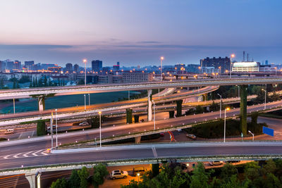 High angle view of elevated road leading towards city