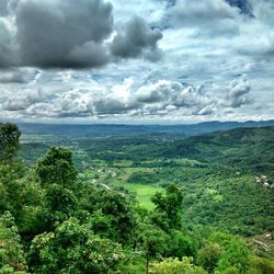 Scenic view of landscape against cloudy sky