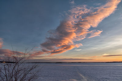 Scenic view of sea against sky at sunset