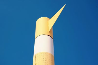 Low angle view of metallic structure against clear blue sky