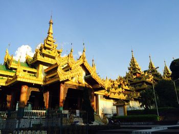 Low angle view of temple against clear blue sky