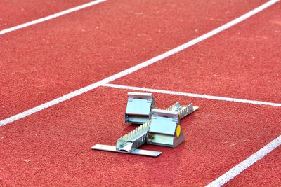 High angle view of starting block on running track