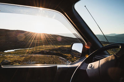 Reflection of car on side-view mirror