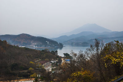 Scenic view of lake and mountains against sky