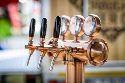 Close-up of brewery machine in cafe