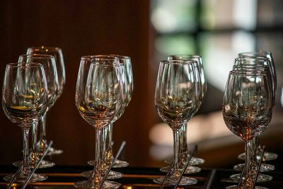 Close-up of wine glasses on table