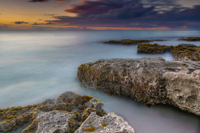 Scenic view of sea against sky during sunset