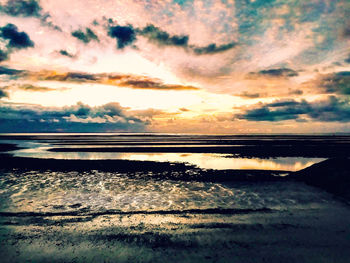 Scenic view of sea against dramatic sky