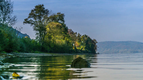 Swimming pool by sea against clear sky