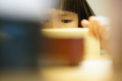 Close-up portrait of girl playing