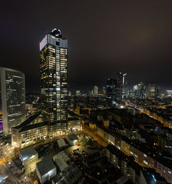 Illuminated buildings in city at night