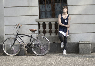 Portrait of woman with bicycle