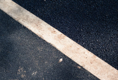 Full frame shot of road marking on city street