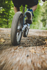 Low section of man riding bicycle