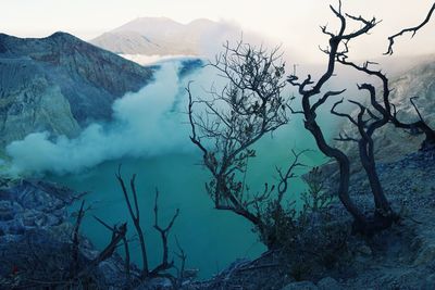 Scenic view of ijen crater by mountain