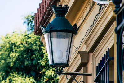 Low angle view of street light against building