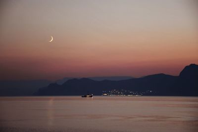 Scenic view of sea against sky at sunset