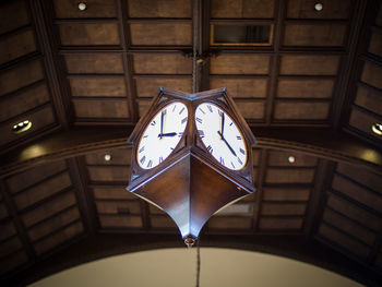 Low angle view of illuminated clock