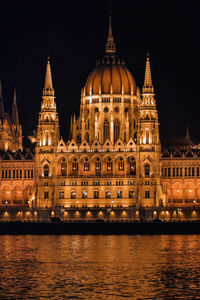 Illuminated hungarian parliament building against sky at night