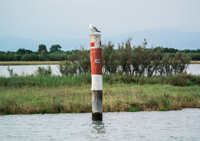 Built structure in front of lake against sky