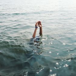 Woman swimming in sea