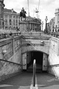 People on bridge in city