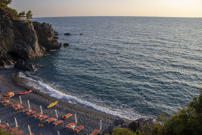 High angle view of rocks on beach against sky