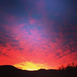 Silhouette of landscape against dramatic sky