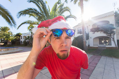 Portrait of young man wearing sunglasses