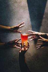 High angle view of woman hand holding drink