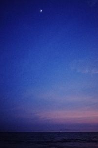 Scenic view of sea against sky at dusk