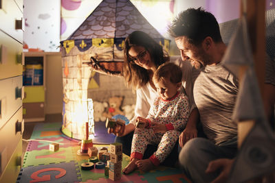 Family playing with toys at home