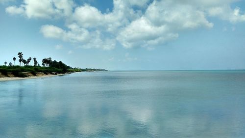 Scenic view of sea against cloudy sky