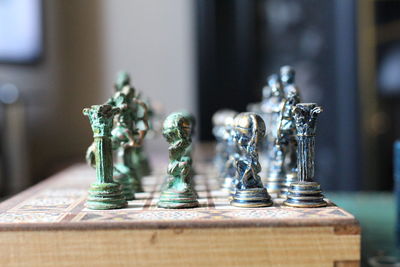 Close-up of chess pieces on book