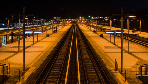 High angle view of railway tracks at night