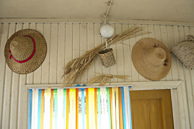 Multi colored umbrellas hanging on wall